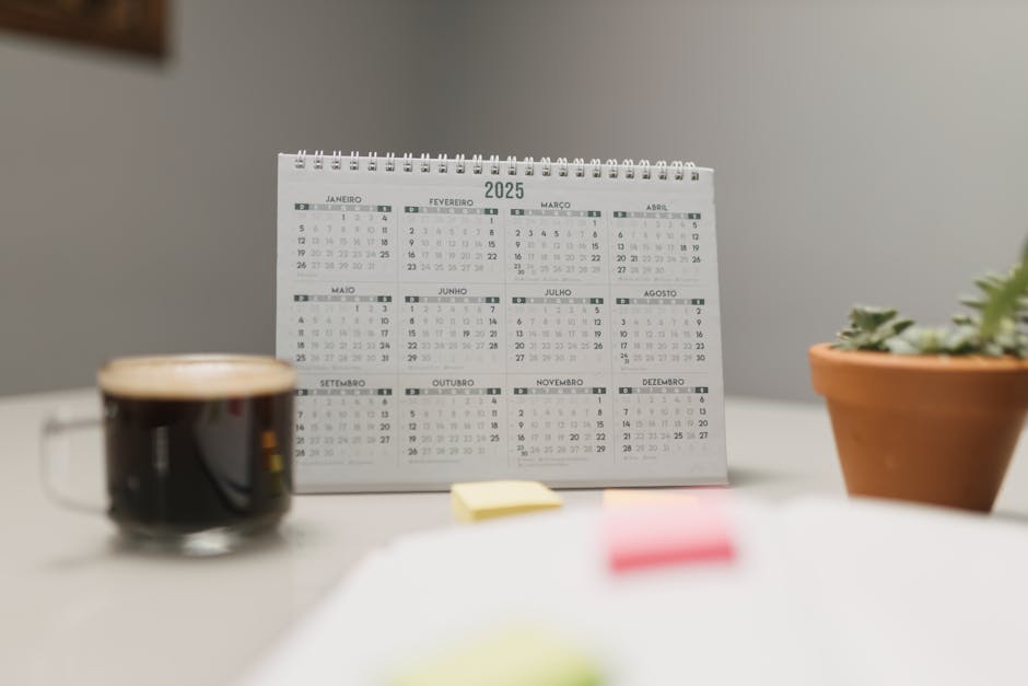 Pet insurance waiting period mapped on a desk calendar: a tidy 2025 desk calendar on an office surface, the kind of simple visual that helps households plot the pet insurance waiting period against scheduled veterinary visits before submitting any new enrollment application